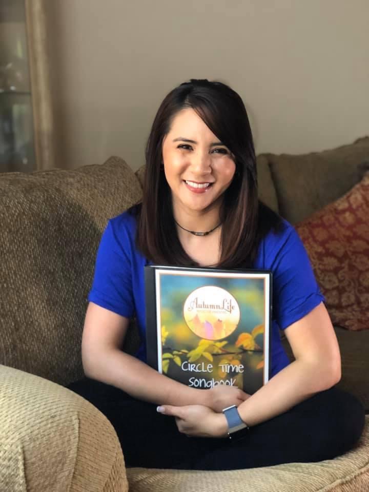 Clarice holding autumnlife circle time song book