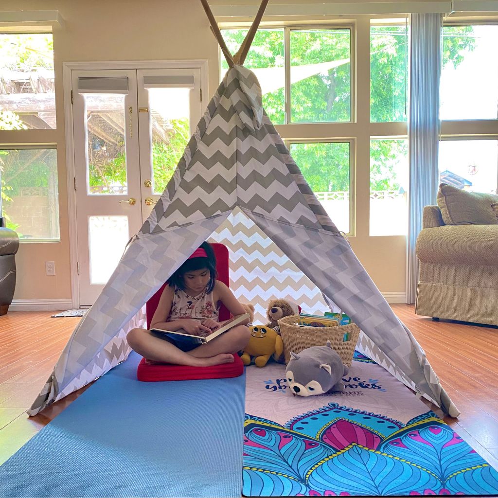 Zoe reading under the tent. Autumnlife Reflective Parenting